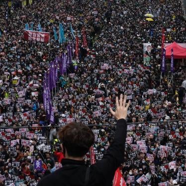 A protestor shows five demands gesture as Hong Kong people participate in their annual pro-democracy march in Hong Kong, January 1, 2020. 