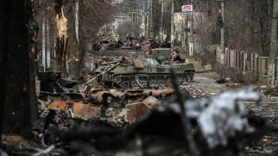 Destroyed armored vehicles on a road