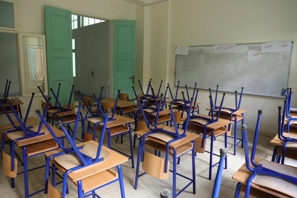 Chairs are placed on classroom tables at a closed public school in Beirut.