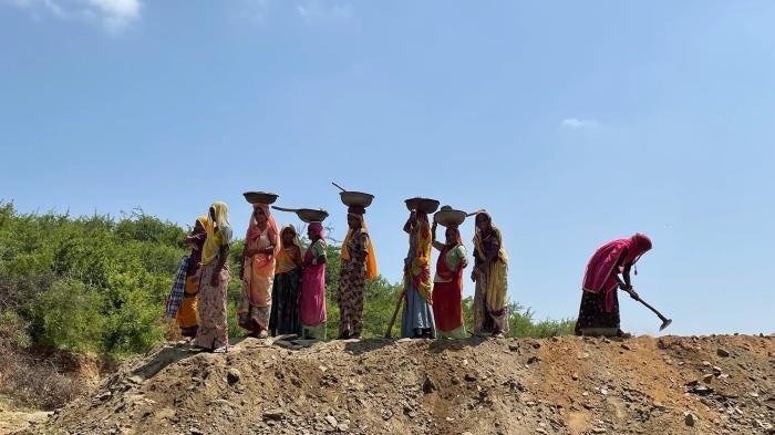 Women working at a job site in a village in Rajasthan under the Mahatma Gandhi National Rural Employment Guarantee Act (NREGA), September 2022. NREGA is the Indian government’s income security program in rural India.