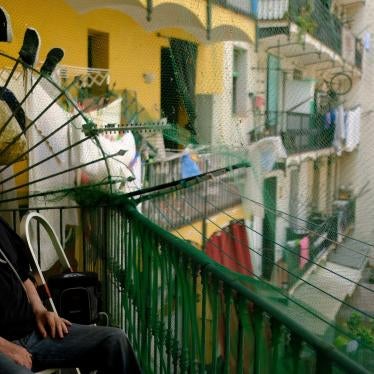 Fernando Uceta, who has COPD, uses a portable oxygen concentrator to breathe as he sits on the balcony of his home during the summer heatwave, in Barcelona's Raval neighbourhood, Spain, June 27, 2023.