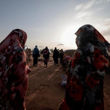  Survivors of sexual violence, who fled the fighting in El Geneina, in Sudan’s Darfur region, outside their makeshift shelters in Adre, Chad, August 1, 2023. © 2023 REUTERS/Zohra Bensemra