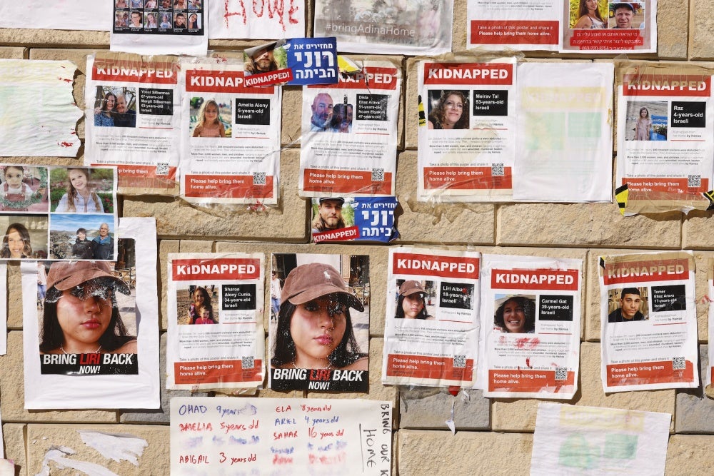 Photographs of Israelis taken as hostages during an October 7 attack by Hamas-led fighters, at a protest demanding their release, outside the HaKirya military base in Tel Aviv, Israel, on October 17, 2023. 