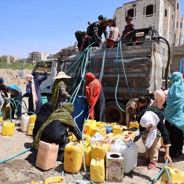 A group of women and children get water from a water truck in the Osaifera area, Taizz, March 7, 2023. 