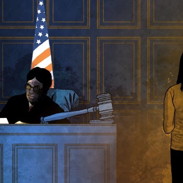 A girl stands in front of a judge in a courtroom