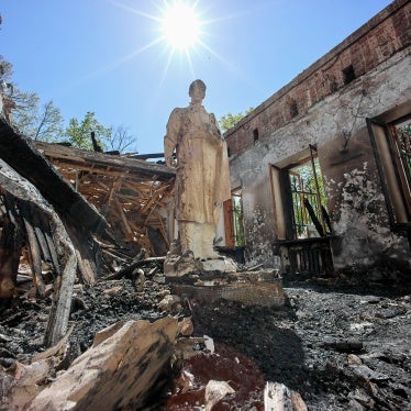 A statue stands amidst the ruins of a museum 