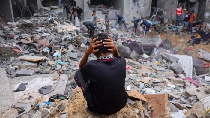 eople salvage belongings amid the rubble of a damaged building following strikes on Rafah in the southern Gaza Strip, November 12, 2023. 