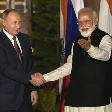 Russian President Vladimir Putin and Indian Prime Minister Narendra Modi greet each other before their meeting in New Delhi, India, December 6, 2021.