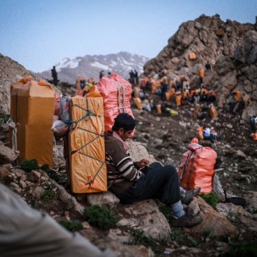 Kulbars carry goods on their backs along the mountains of the Iran-Iraq border, Kurdistan, Iran, April 29, 2017.