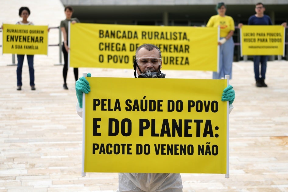 Activists protest the use of pesticides outside the National Congress in Brasilia, Brazil, on October 4, 2023. 