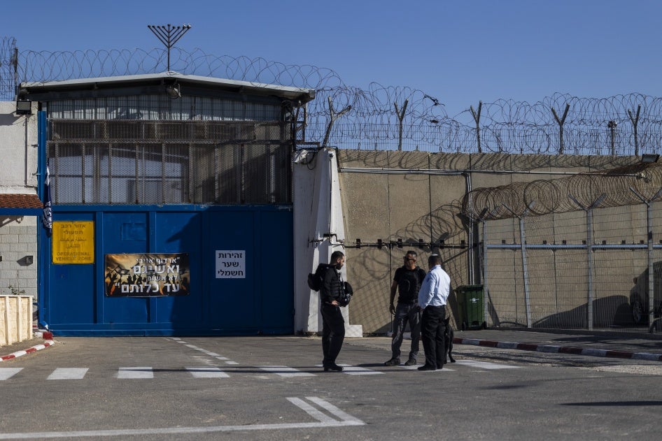 Israeli prison guards at the entrance of Ofer prison, in the occupied West Bank, awaiting Palestinian prisoners' arrival from another Israeli prison, November 24, 2023. 