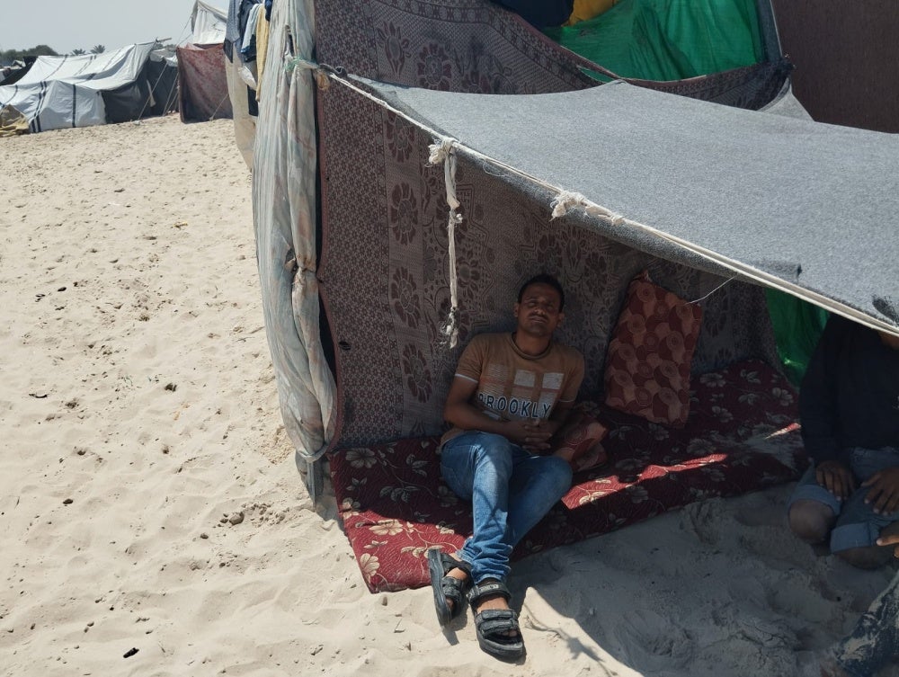 Walid Khalili, sheltering alone in a tent in al-Mawasi, Khan Younis, unable to reach his wife and three boys who are in northern Gaza. The photo was taken on June 18, 2024, about four months following his release from Israeli detention. 