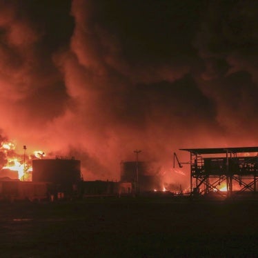 Oil tanks burn following an Israeli strike at the port in Hodeidah, Yemen, July 20, 2024. 