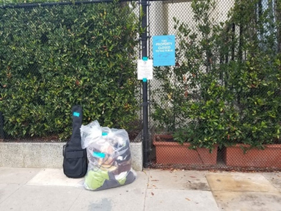 items in a tagged bags on a sidewalk