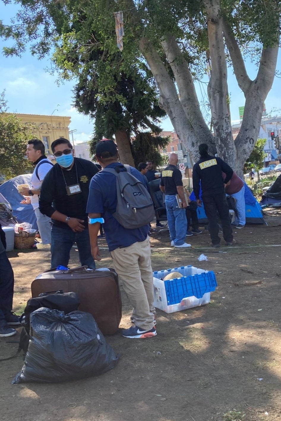 Outreach worker speaks to an encampment resident