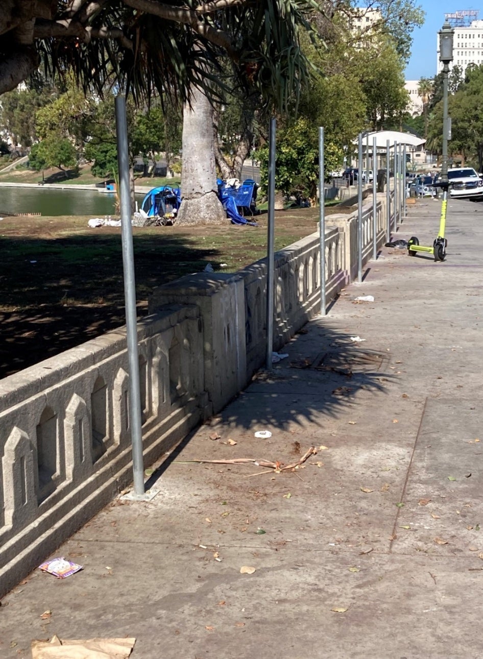 Poles bolted into the ground outside a park