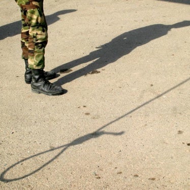 Shadows of an Iranian policeman and a noose are seen on the ground before an execution in Tehran, Iran. 